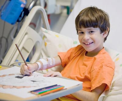 An autistic child in the clinic for stem cells enjoys his play.